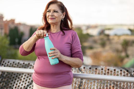 Senior woman drinking water