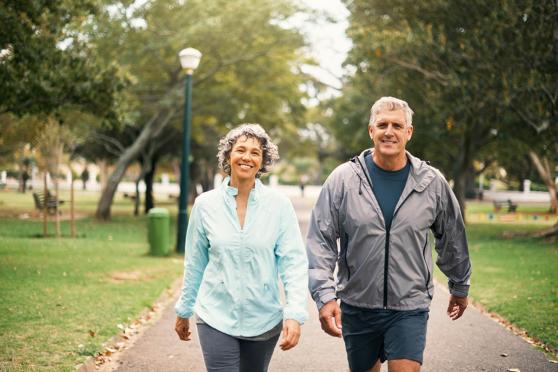 Couple walking in park together
